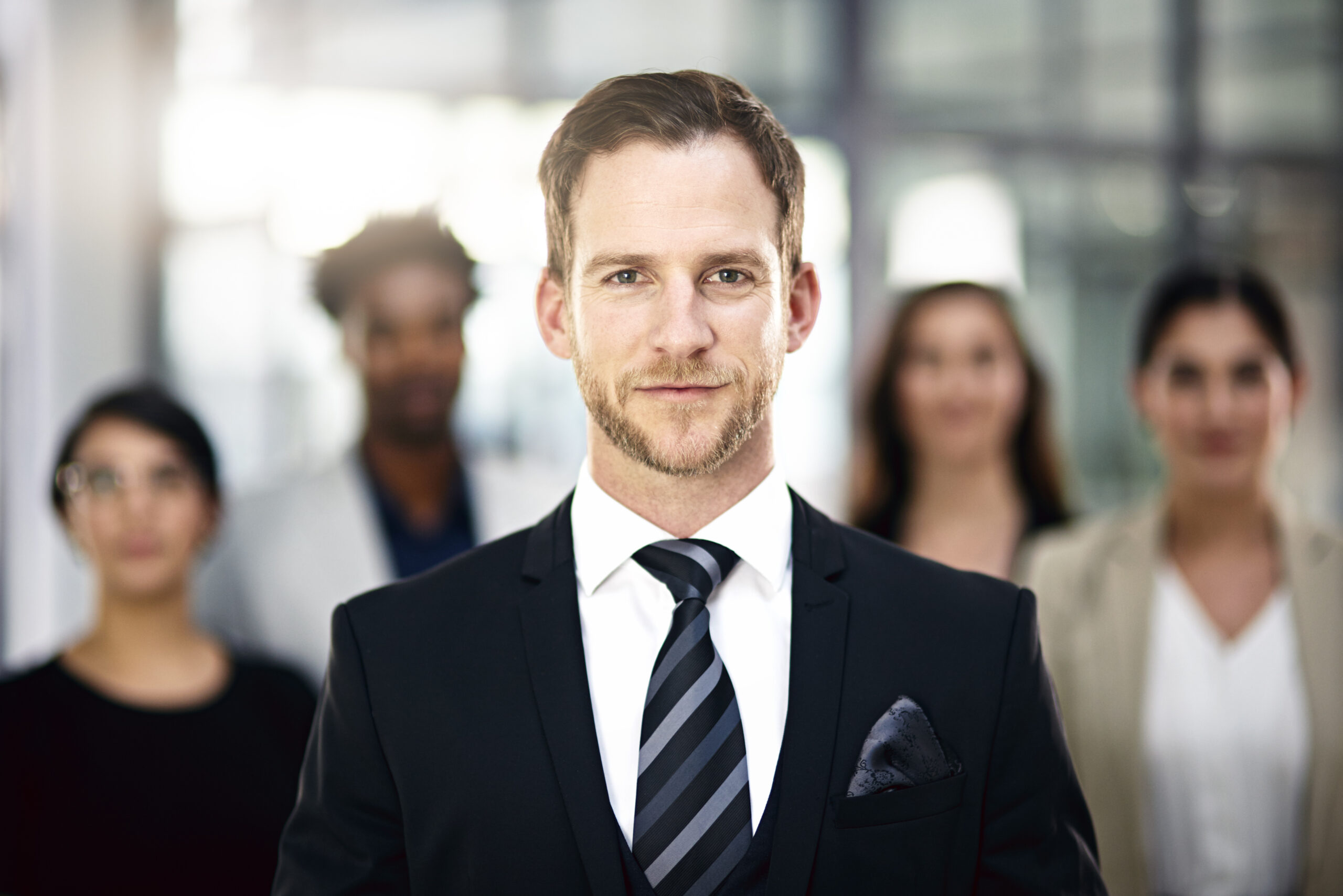 Corporate confidence. Cropped portrait of a group of businesspeople standing in the office